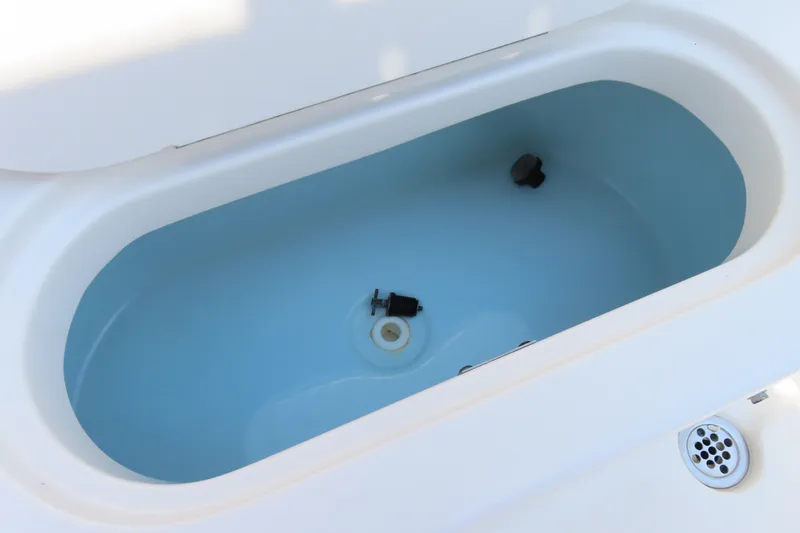 Slide: The Image of Livewell compartment in 2017 Key West 203 FS boat, featuring clean white interior. - 29