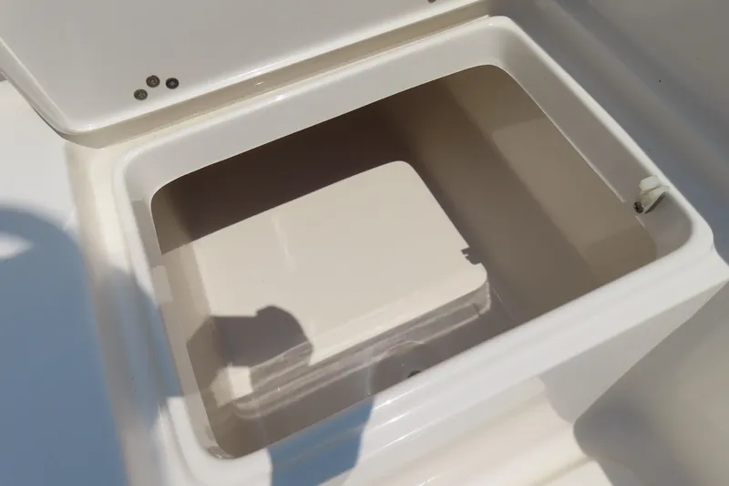 Slide: The Image of Open storage compartment on 2017 Key West 203 FS boat, featuring a clean white interior. - 30
