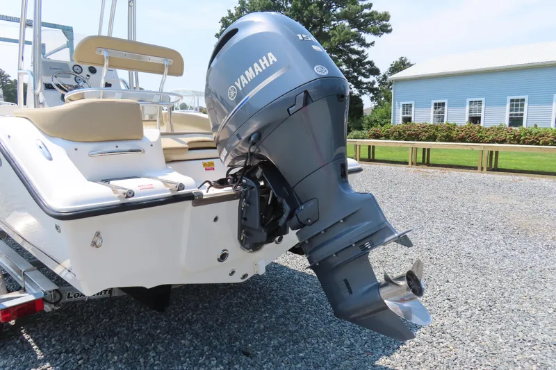 Slide: The Image of 2017 Key West 203 FS boat with Yamaha outboard motor on gravel driveway. - 4