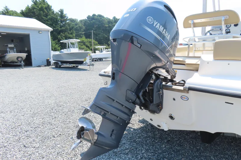 Slide: The Image of 2017 Key West 203 FS boat with Yamaha outboard motor in a marina setting. - 5