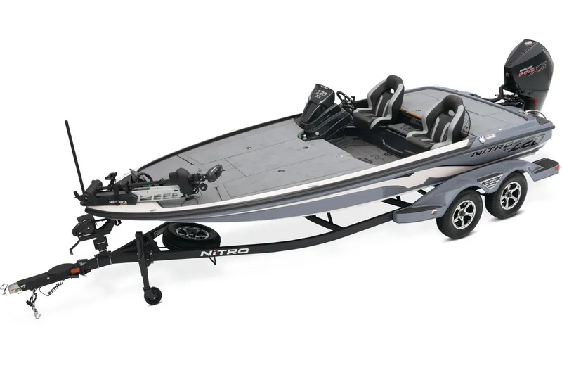 Slide: The Image of 2026 Nitro Z20 XL Pro fishing boat with advanced Garmin equipment, parked outdoors. - 1