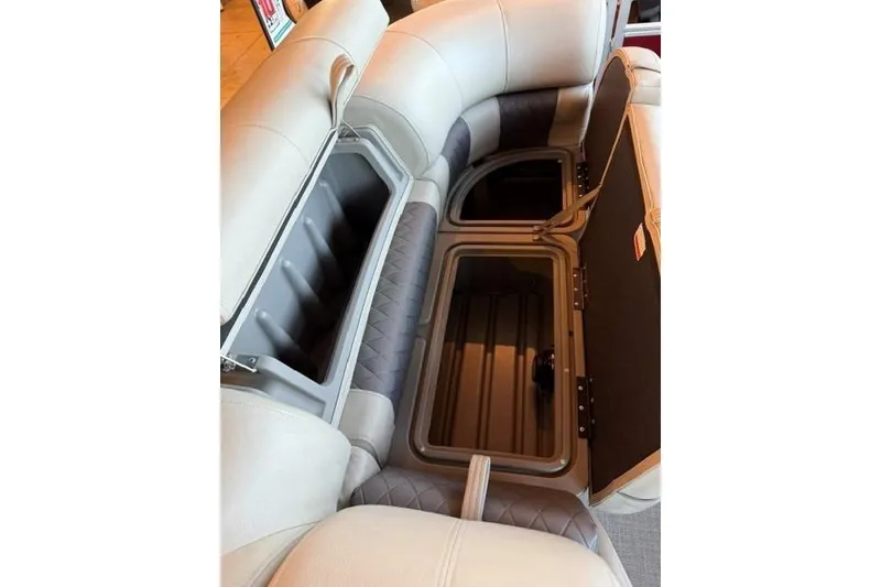 Slide: The Image of Interior storage compartments of 2025 Sun Tracker Party Barge 24 DLX pontoon boat. - 9