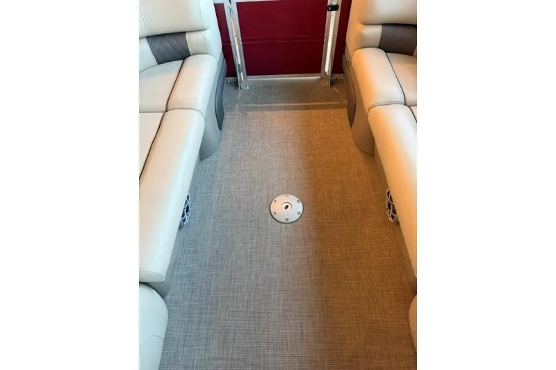 Slide: The Image of Interior of 2025 Sun Tracker Party Barge 24 DLX with beige seating and flooring. - 10