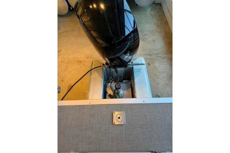 Slide: The Image of 2025 Sun Tracker Party Barge 24 DLX outboard motor and deck detail. - 80