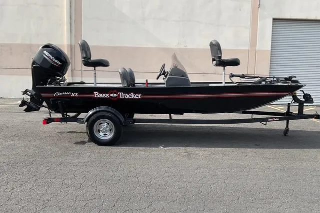 The Image of 2026 Tracker Bass Tracker Classic XL boat on trailer, side view. - 0
