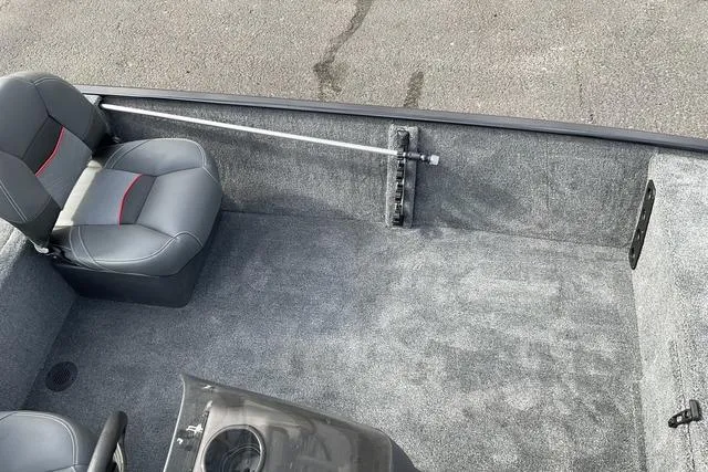 Slide: The Image of 2026 Tracker Bass Tracker Classic XL boat interior with gray carpet and seating. - 11