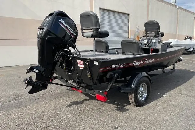 Slide: The Image of 2026 Tracker Bass Tracker Classic XL boat with Mercury engine on trailer. - 3