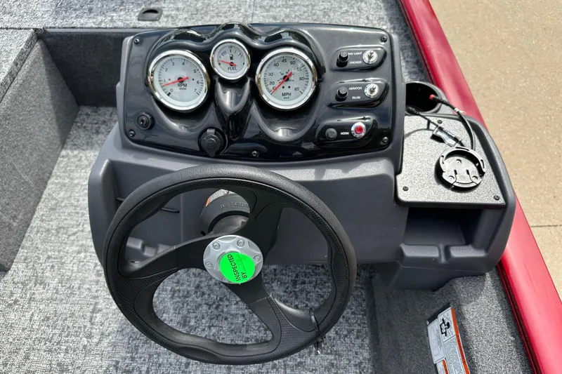 Slide: The Image of 2026 Tracker Pro 170 boat dashboard with steering wheel and gauges. - 5