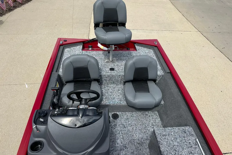 Slide: The Image of 2026 Tracker Pro 170 boat interior with gray seating and steering console. - 6
