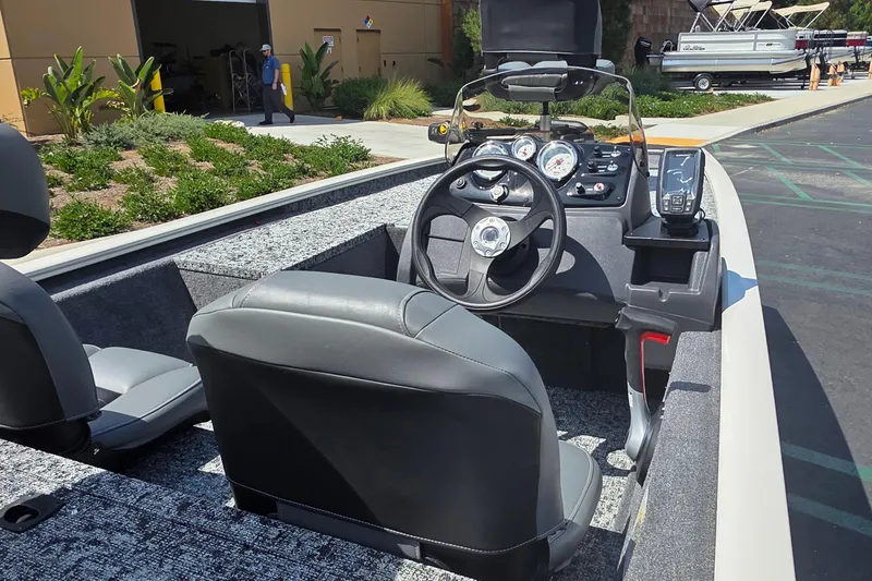 Slide: The Image of 2026 Tracker Pro 170 boat interior with steering wheel and dashboard controls. - 2