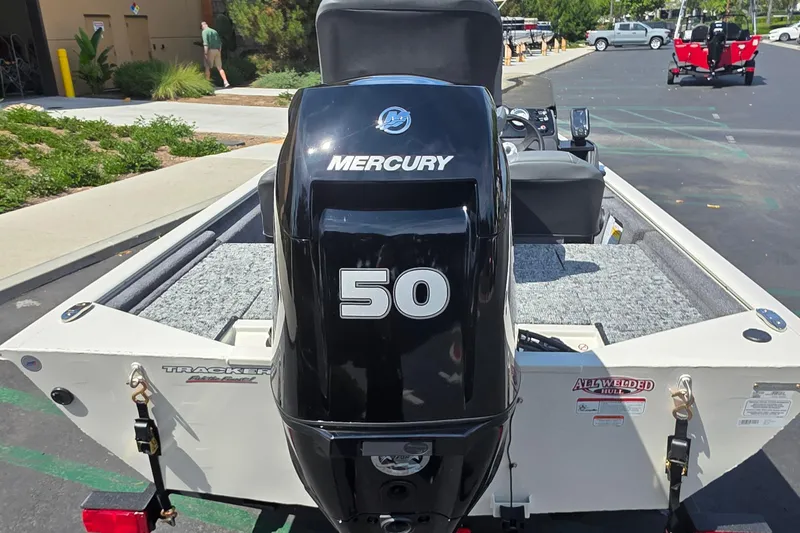Slide: The Image of 2026 Tracker Pro 170 boat with Mercury 50 outboard motor in parking lot. - 3