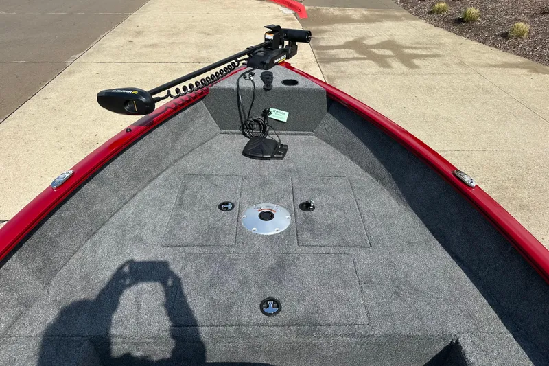 Slide: The Image of 2025 Tracker Super Guide V-16 T boat deck with trolling motor and carpeted surface. - 3