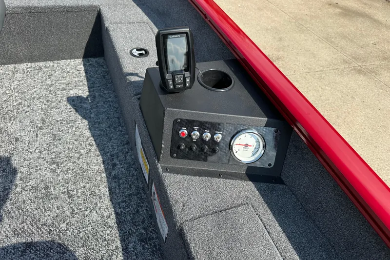 Slide: The Image of 2025 Tracker Super Guide V-16 T boat dashboard with Garmin device and RPM gauge. - 4