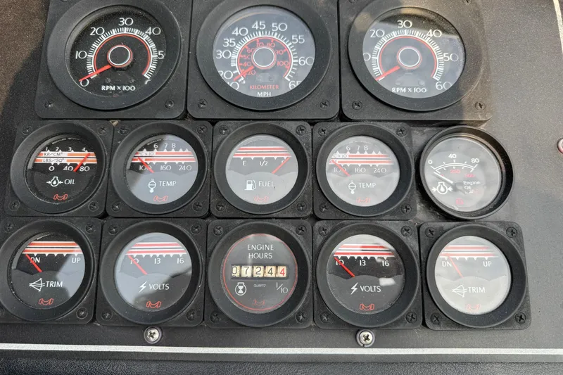Slide: The Image of Dashboard of a 1984 Formula 272 boat with various gauges and meters. - 10