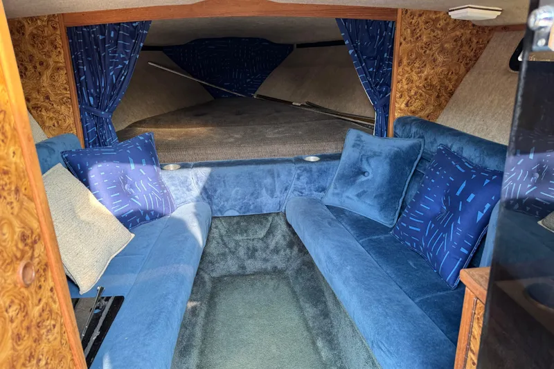 Slide: The Image of Interior of a 1984 Formula 272 boat with blue upholstery and wood accents. - 4