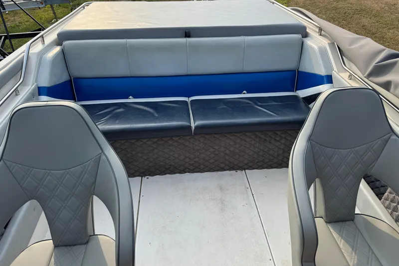 Slide: The Image of Interior of a 1984 Formula 272 boat with gray and blue seating. - 8