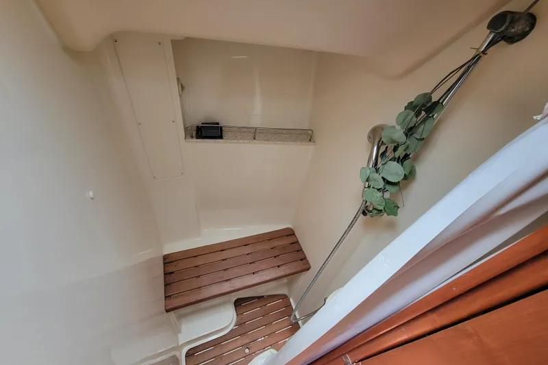 Slide: The Image of Compact shower area in a 2009 Hunter 49 yacht with wooden flooring and modern fixtures. - 10