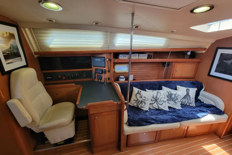 Slide: The Image of Interior of a 2009 Hunter 49 yacht with cozy seating and nautical decor. - 4