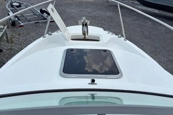 Slide: The Image of 2006 Boston Whaler 205 Conquest boat deck with hatch and anchor. - 9