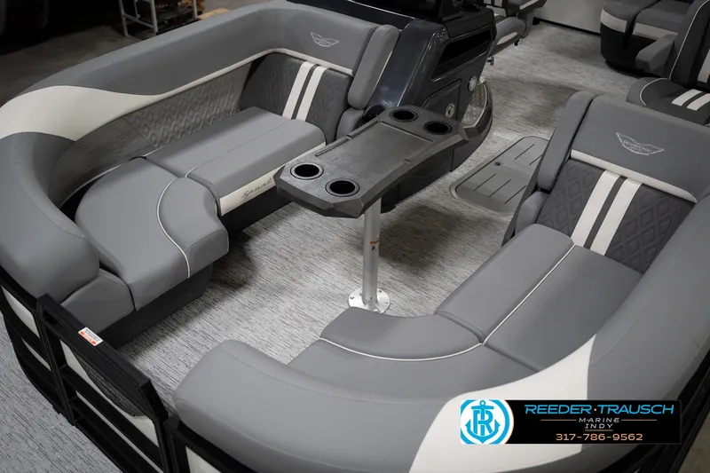 Slide: The Image of 2026 Bennington 22 MSB boat interior with gray seating and cup holders. - 11