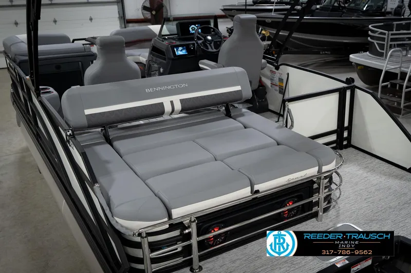 Slide: The Image of 2026 Bennington 22 MSB pontoon boat interior with gray seating and modern dashboard. - 14