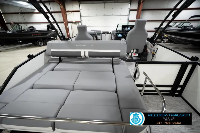 Slide: The Image of 2026 Bennington 22 MSB boat interior with gray seating in showroom. - 18
