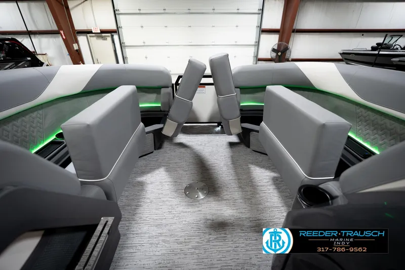 Slide: The Image of 2026 Bennington 22 MSB boat interior with modern seating and ambient lighting. - 22