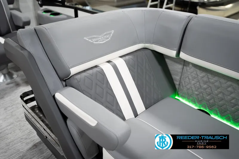 Slide: The Image of Luxurious seating on 2026 Bennington 22 MSB boat with elegant gray upholstery and ambient lighting. - 24