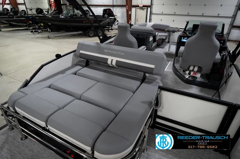 Slide: The Image of 2026 Bennington 22 MSB pontoon boat interior with gray seating in showroom. - 25
