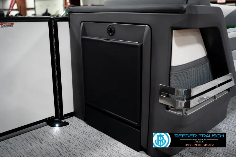 Slide: The Image of Interior of 2026 Bennington 22 MSB boat with sleek black paneling and modern design. - 29