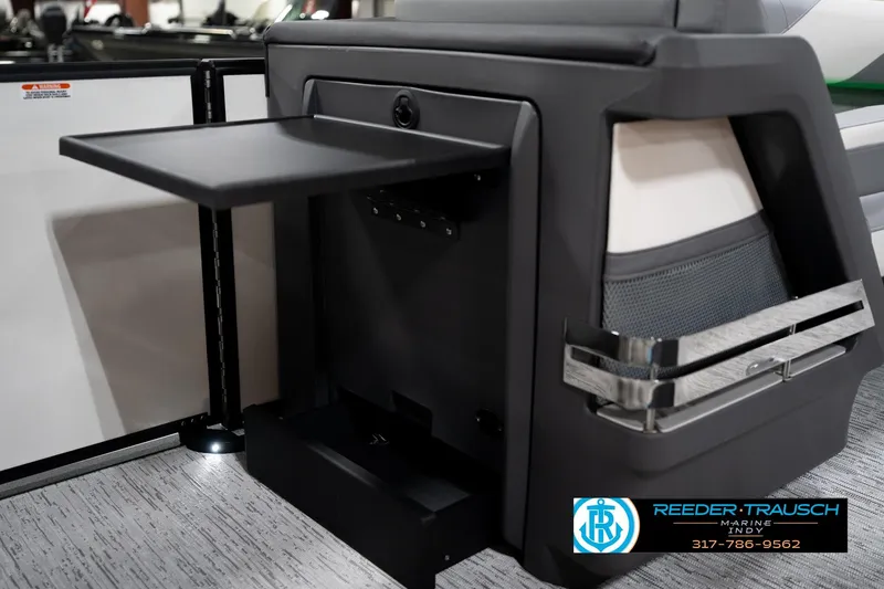 Slide: The Image of 2026 Bennington 22 MSB boat interior with fold-out table and storage compartment. - 31