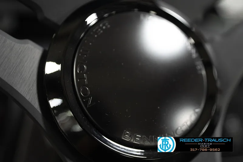 Slide: The Image of Close-up of a 2026 Bennington 22 MSB boat detail with Reeder-Trausch Marine logo. - 34