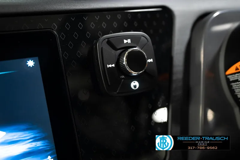 Slide: The Image of 2026 Bennington 22 MSB dashboard with audio control knob and display screen. - 36