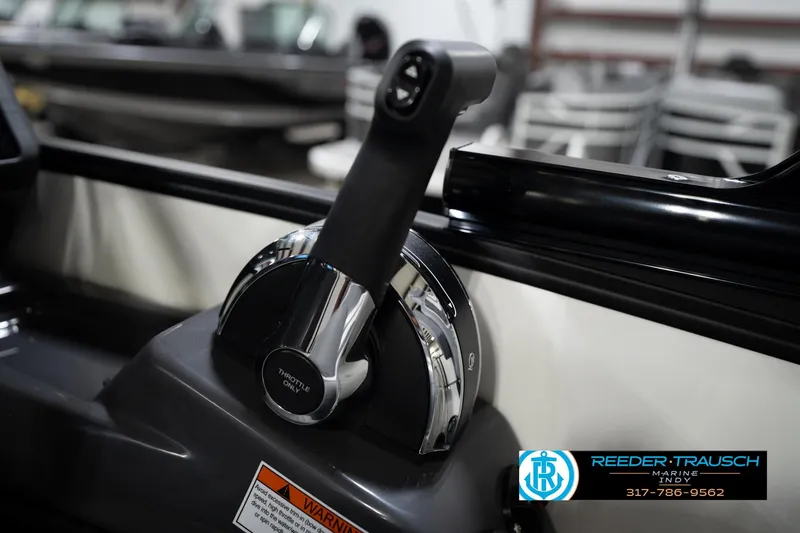 Slide: The Image of Throttle control of 2026 Bennington 22 MSB boat, featuring sleek design and warning label. - 39