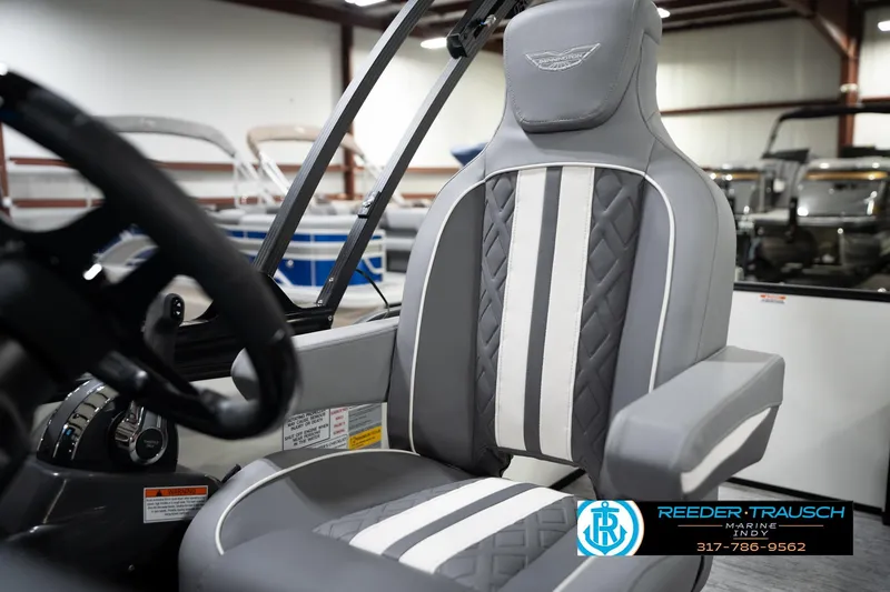 Slide: The Image of 2026 Bennington 22 MSB boat seat with gray and white upholstery in showroom. - 40
