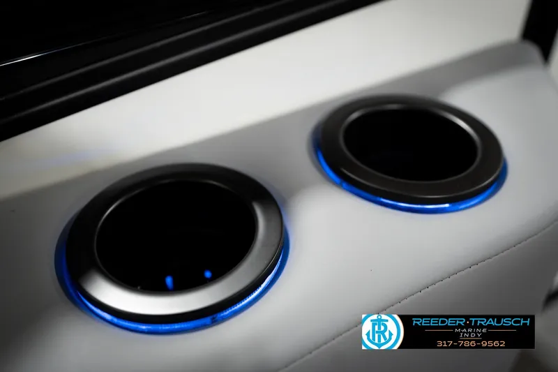 Slide: The Image of Illuminated cup holders on 2026 Bennington 22 MSB boat, featuring blue LED lighting. - 45