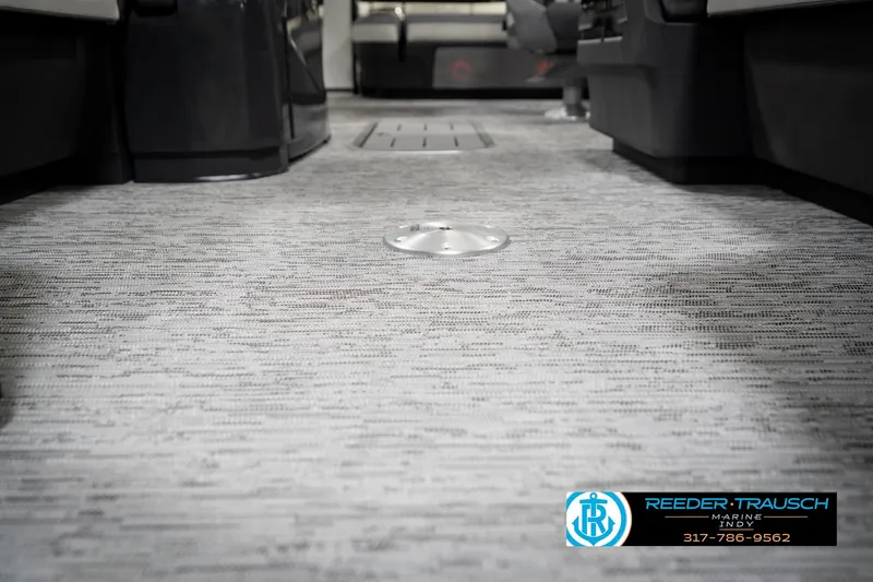 Slide: The Image of 2026 Bennington 22 MSB boat interior with textured flooring and Reeder Trausch Marine logo. - 46