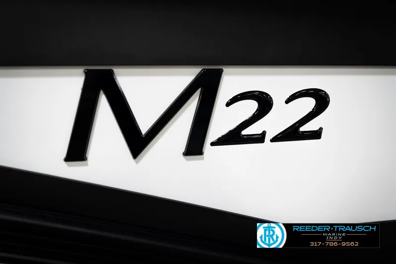 Slide: The Image of Close-up of 2026 Bennington 22 MSB model emblem with dealership logo. - 50