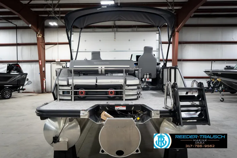 Slide: The Image of 2026 Bennington 22 MSB pontoon boat in showroom, featuring sleek design and modern amenities. - 8