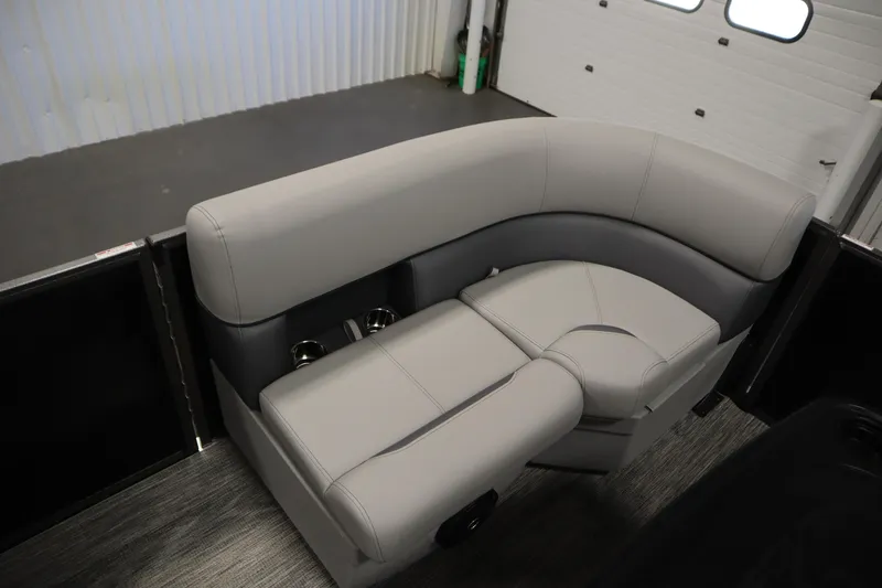 Slide: The Image of 2026 Bentley Pontoons LE 180 CR interior seating with gray upholstery and cup holders. - 11