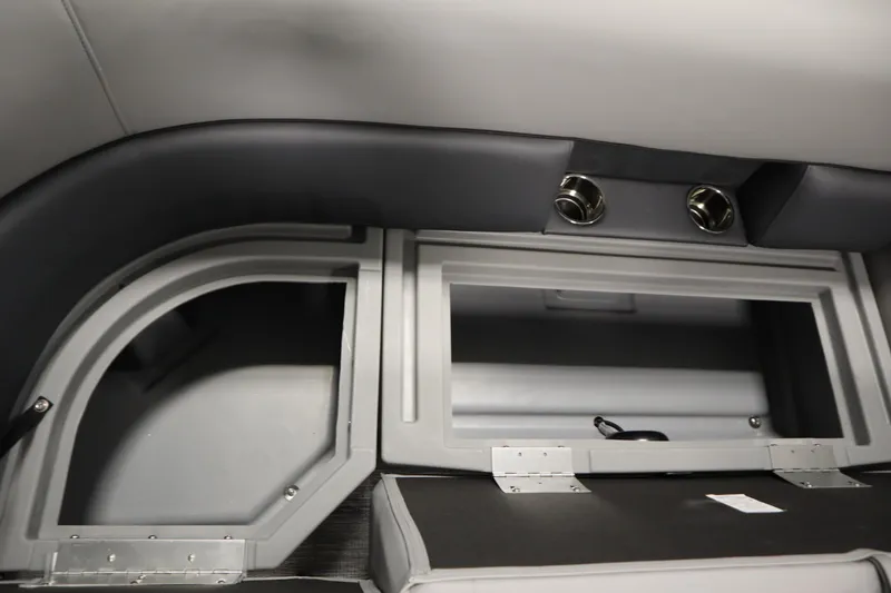 Slide: The Image of 2026 Bentley Pontoons LE 180 CR interior storage compartment with sleek design and metallic accents. - 14