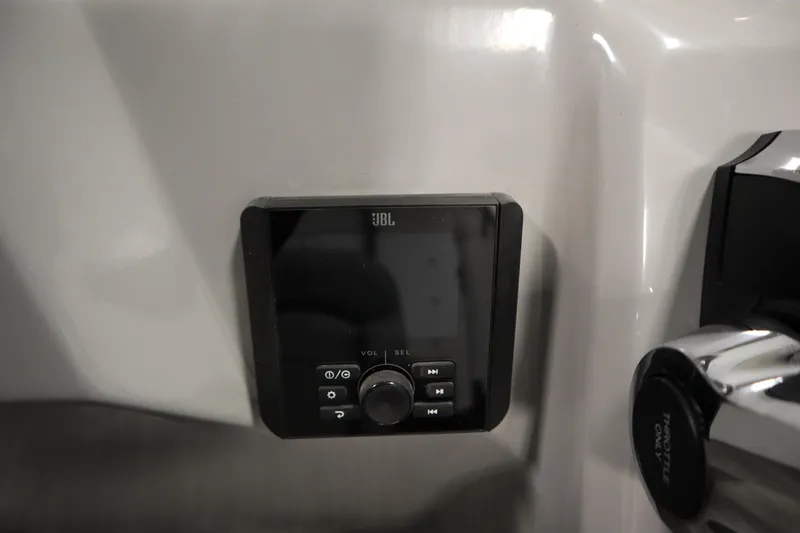 Slide: The Image of JBL audio control panel in 2026 Bentley Pontoons LE 180 CR boat interior. - 22