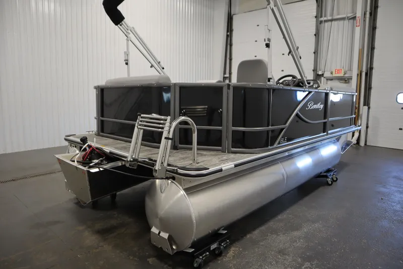 Slide: The Image of 2026 Bentley Pontoons LE 180 CR in a showroom, showcasing sleek design and modern features. - 4