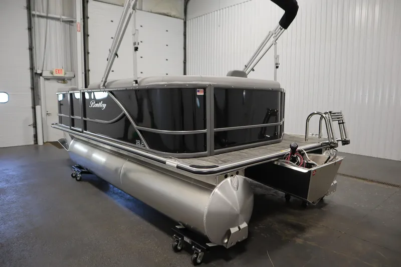 Slide: The Image of 2026 Bentley Pontoons LE 180 CR in showroom, sleek design and modern features. - 6