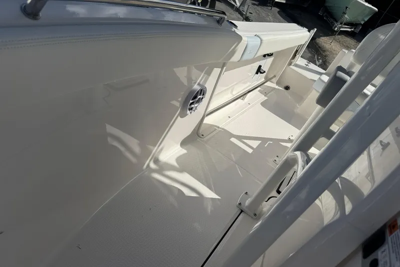 Slide: The Image of 2025 Robalo R222 Explorer boat interior, featuring sleek white design and modern amenities. - 14