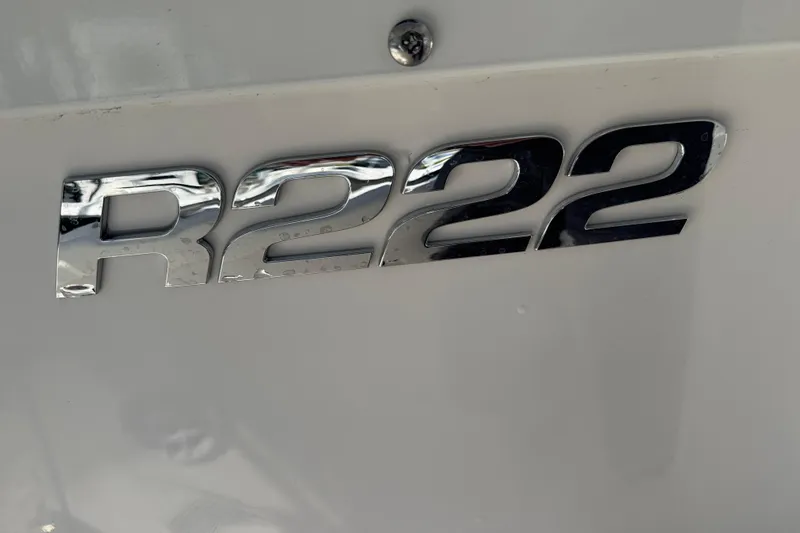 Slide: The Image of Chrome R222 emblem on 2025 Robalo R222 Explorer boat. - 15