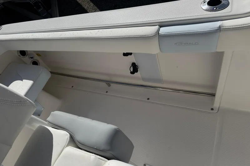 Slide: The Image of 2025 Robalo R222 Explorer boat interior with white seating and stainless steel accents. - 17