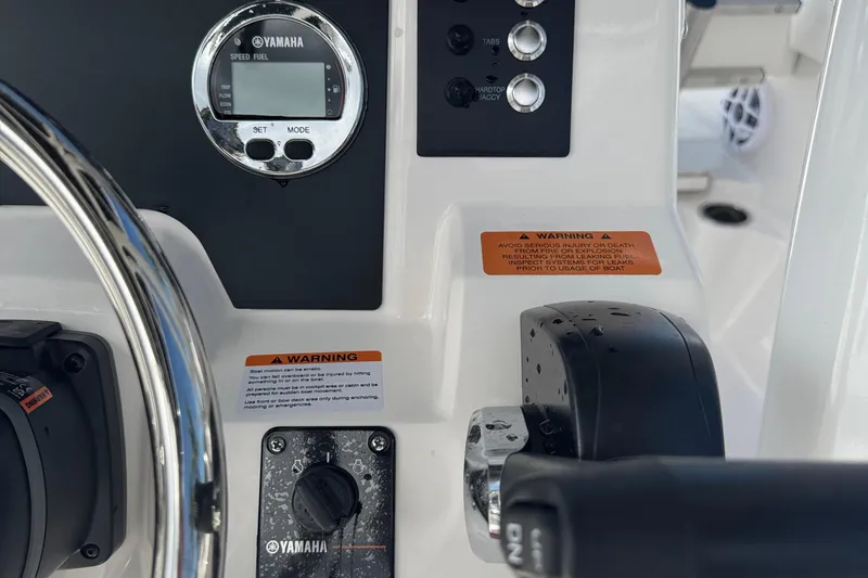 Slide: The Image of 2025 Robalo R222 Explorer dashboard with Yamaha controls and warning labels. - 21