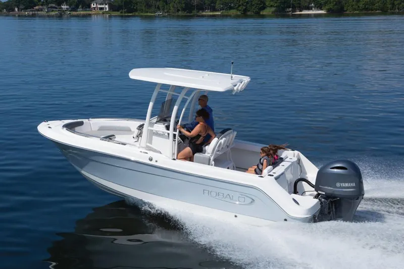Slide: The Image of Manufacturer Provided Image: 2025 Robalo R222 Explorer boat cruising on a calm lake. - 23