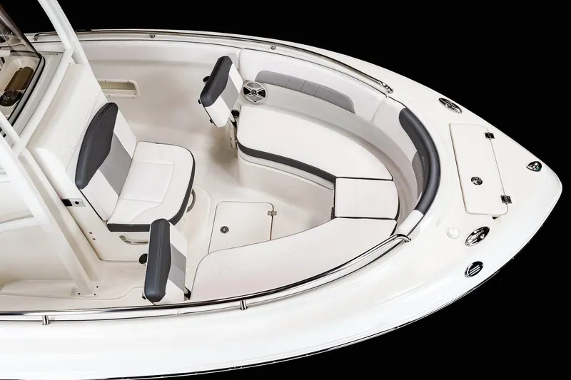 Slide: The Image of Manufacturer Provided Image: 2025 Robalo R222 Explorer boat interior with white seating and sleek design. - 28